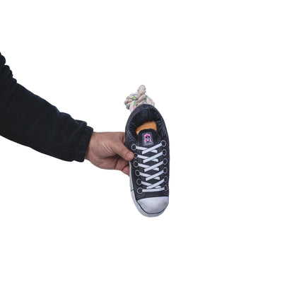 Black plush sneaker dog toy with squeaker