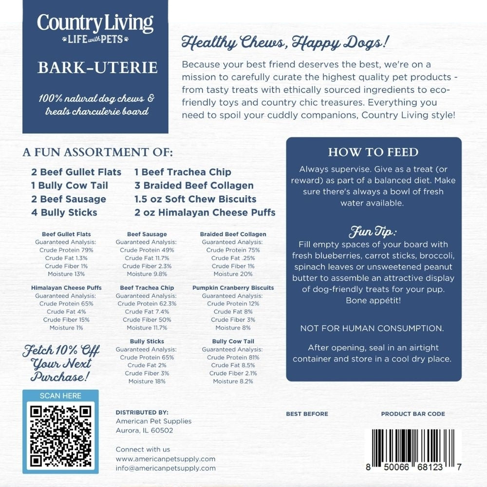Country Living Bark-Uterie Board dog treat assortment with bully sticks, gullet flats, cow tail, chicken sausages, beef trachea, braided collagen sticks, yak chew puffies, and soft chew biscuits arranged on a rustic wood-look cardboard board.