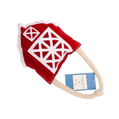 Durable vegan leather dog chew toy shaped like a red barn